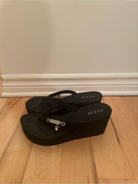 GUESS Black Wedge Flip-Flop Sandals with Silver Charm
